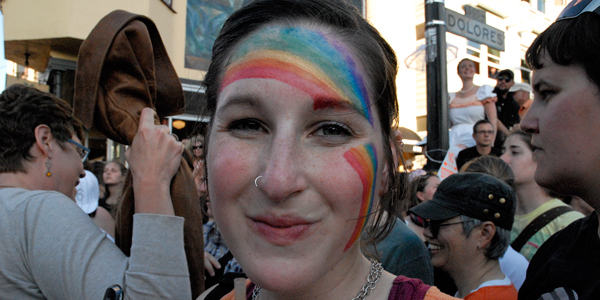 Rainbow-faced woman at Dyke March in San Francisco 2009
