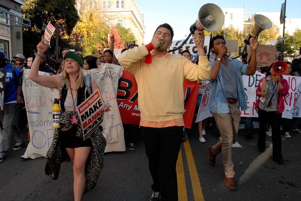 Enthusiastic marching through the streets of Berkeley for OccupyCal Strike