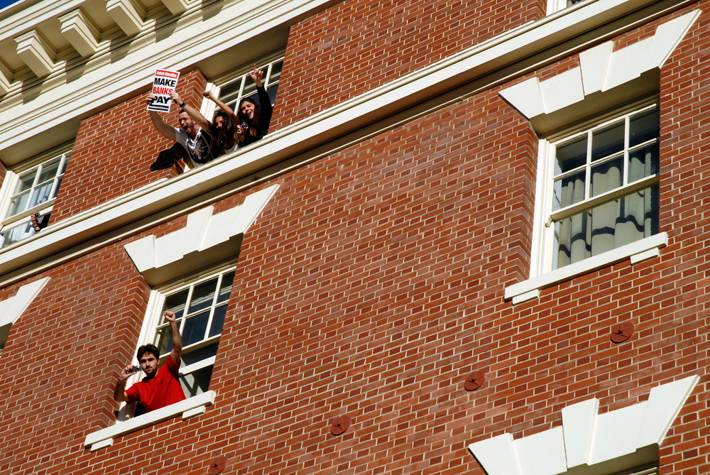 Onlookers from windows during march through Berkeley - Occupy Cal Strike