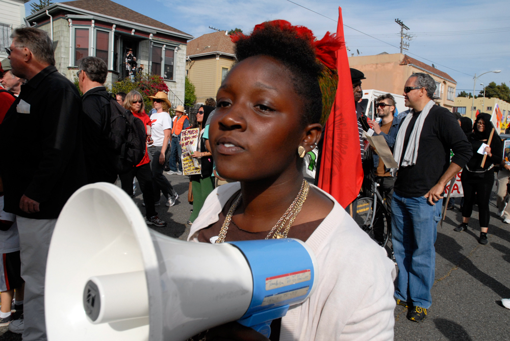 May Day March in Oakland - woman with megaphone