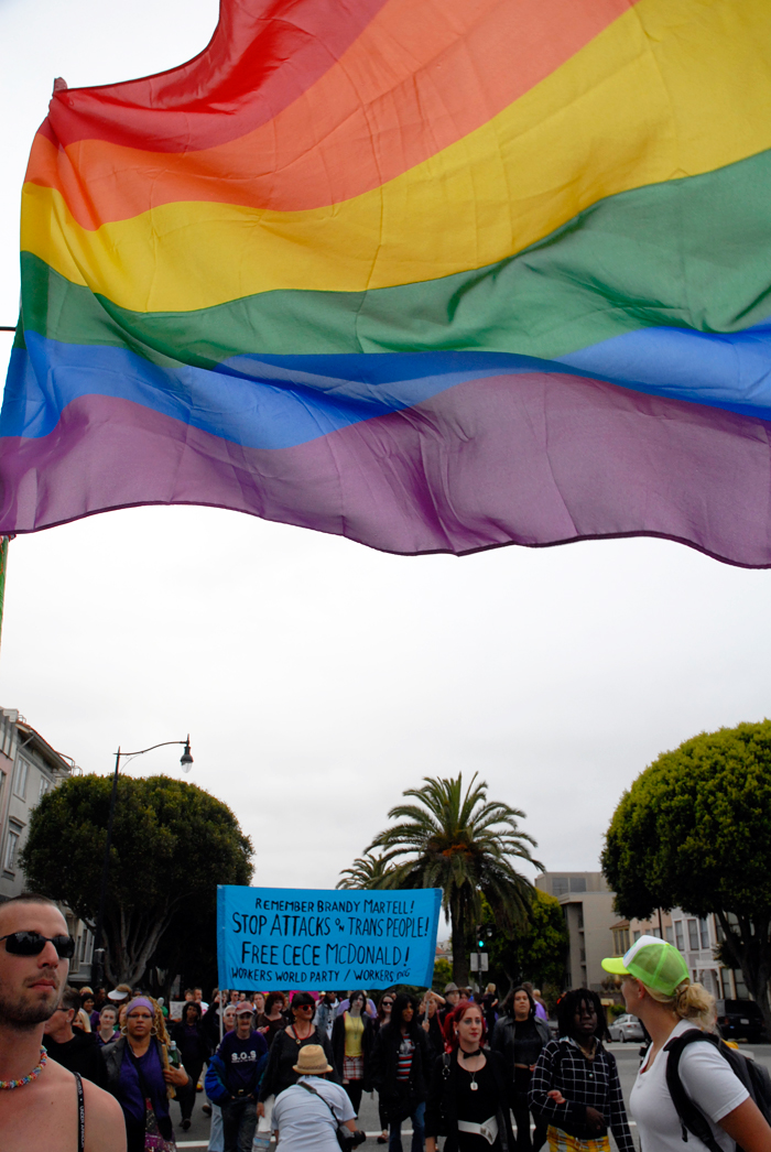 rainbow flag trans marchers