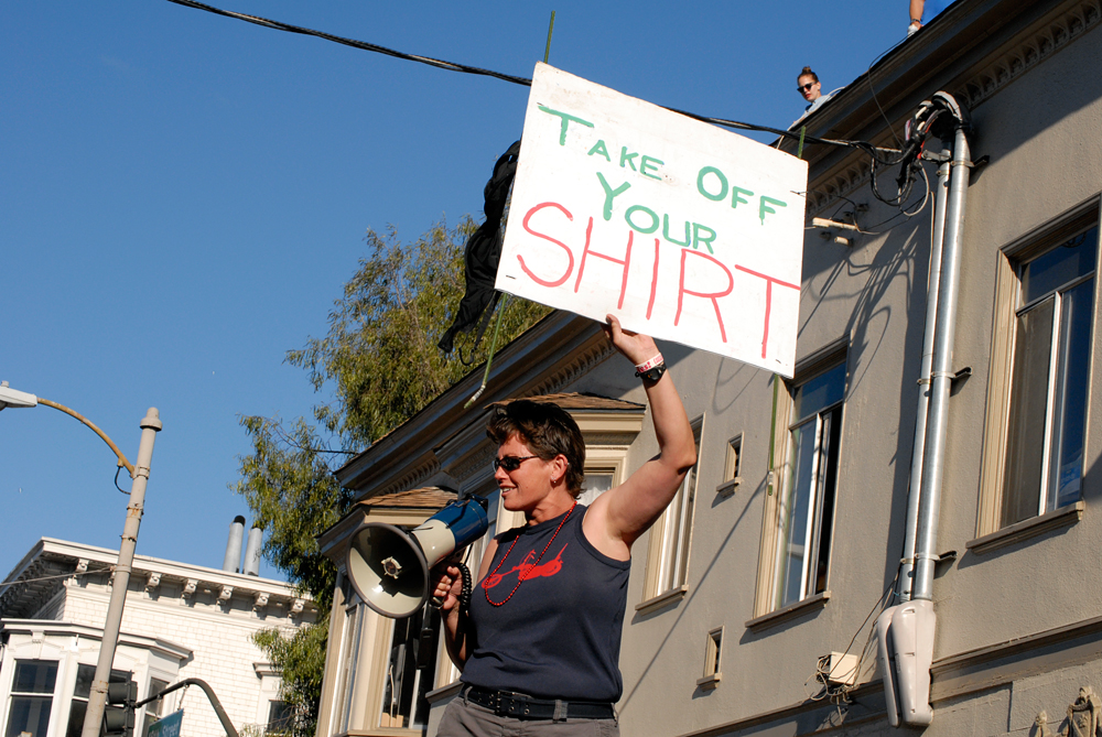Take Off Your Shirt signage along Dyke March route